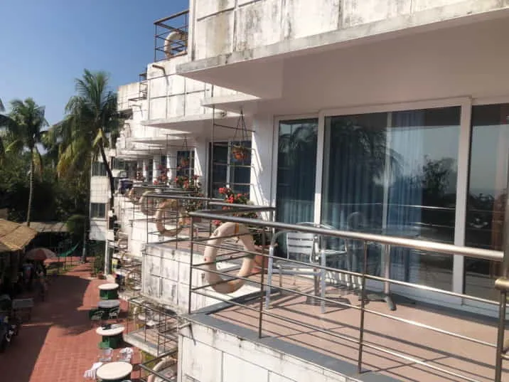Large glazed doors opening onto a balcony with a metal railing