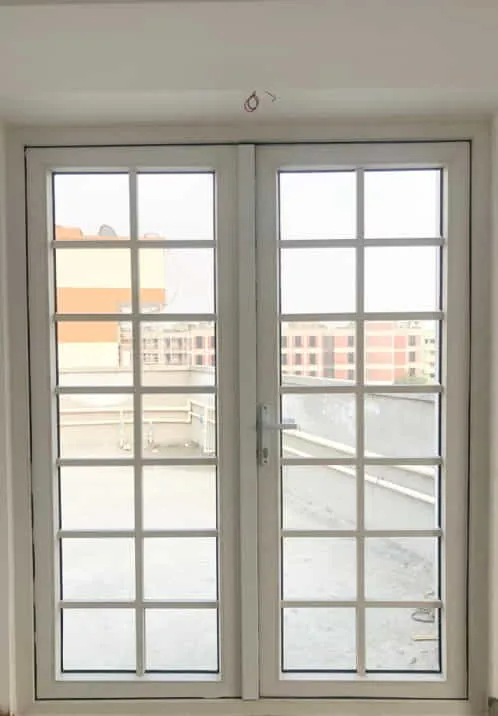 Two white-framed window panels with horizontal external bars