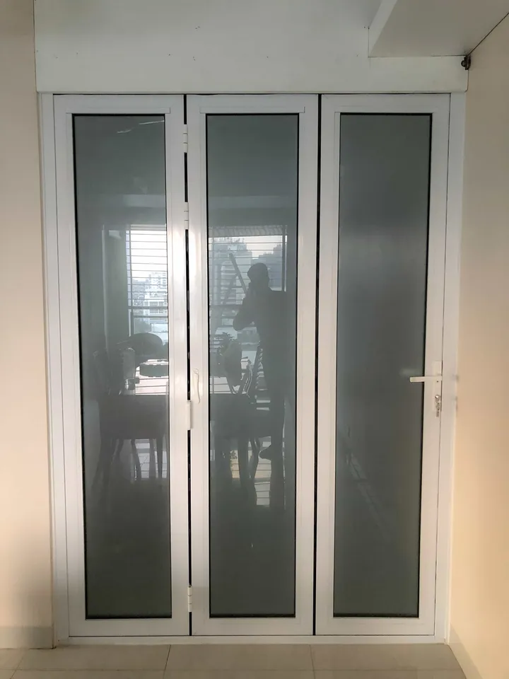 White-framed glass door pair with vertical handles