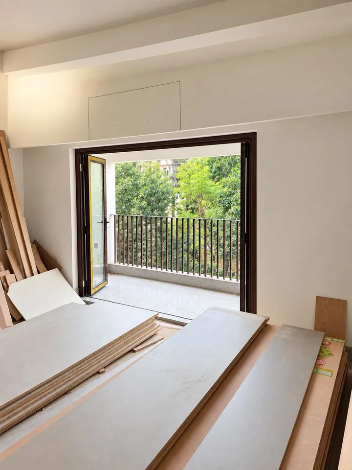Window opening in an unfinished interior with materials on the floor